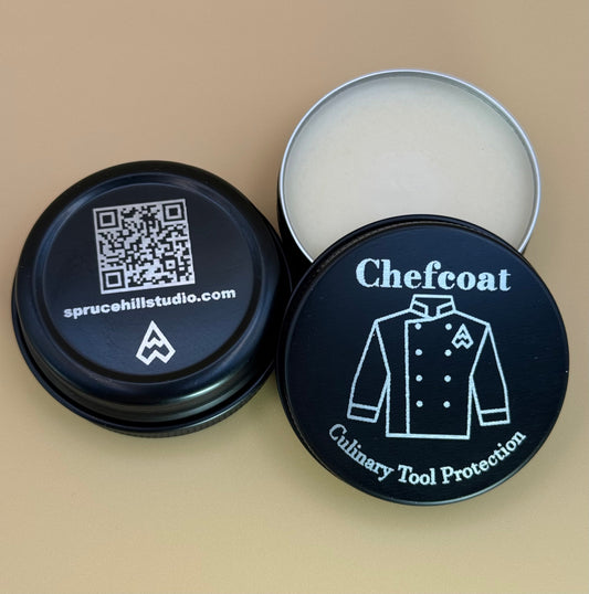 Tin labeled 'Chefcoat' with a black lid featuring a QR code and brand logo on a beige background.